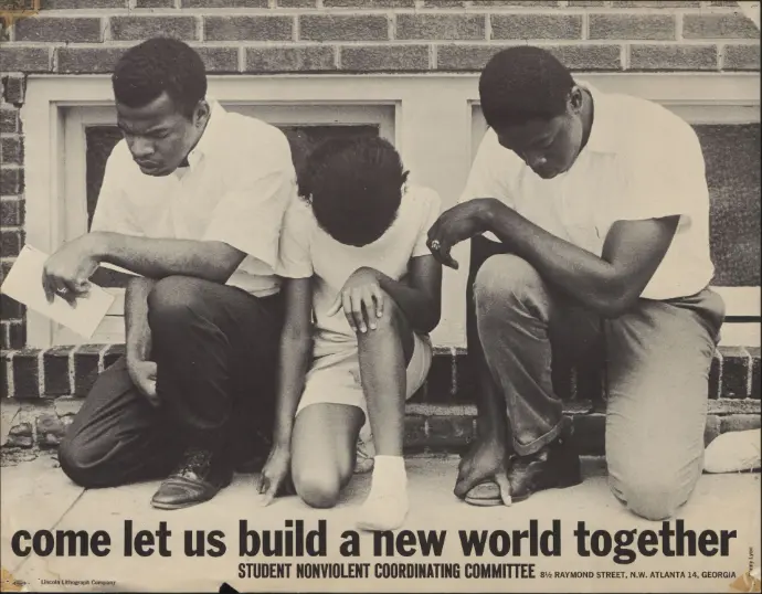 Young Black people taking a knee.